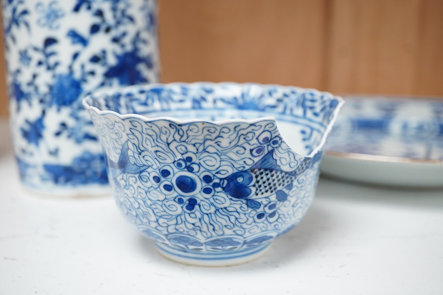 An early 20th century Chinese blue and white sleeve vase, 18th century plate and bowl, tallest 24.5cm